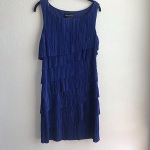 Connected apparel tiered ruffle dress.